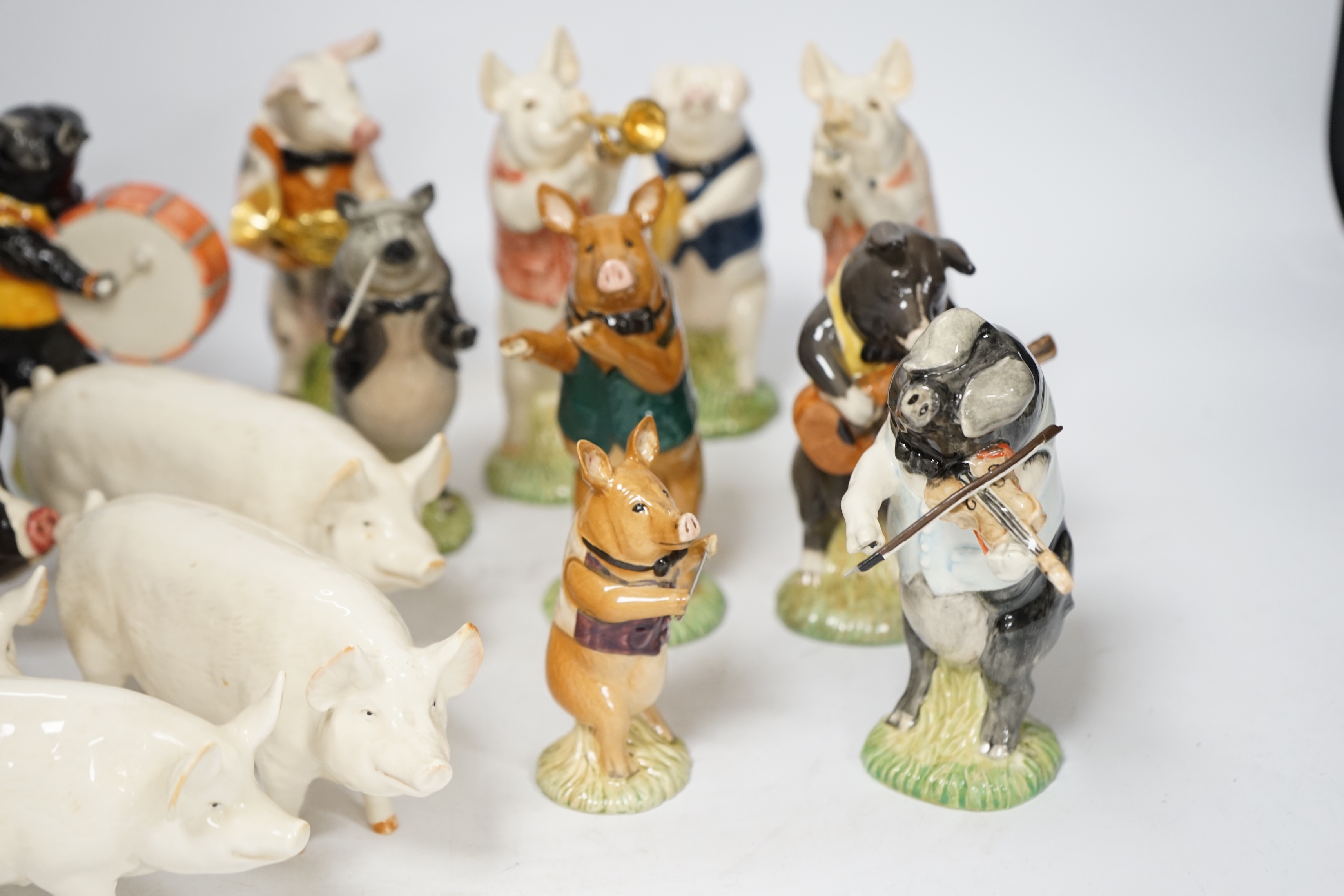 Five Beswick pigs and ten Beswick pig musician band figures